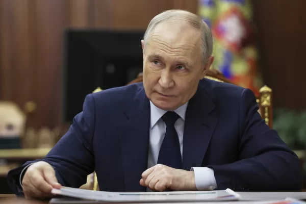 Russian President Vladimir Putin listens to Head of the Chuvash Republic of Russia Oleg Nikolayev at the Kremlin in Moscow, Russia, Wednesday, March 26, 2025. (Vyacheslav Prokofyev, Sputnik, Kremlin Pool Photo via AP)
